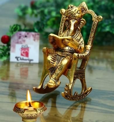 Golden Lord Ganesha Statue Sitting On A Rocking Chair And Reading Ramayan Showpiece - KalaKirtiHub
