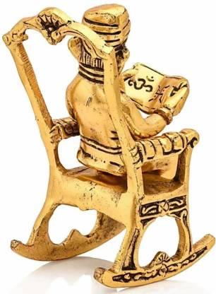 Golden Lord Ganesha Statue Sitting On A Rocking Chair And Reading Ramayan Showpiece - KalaKirtiHub