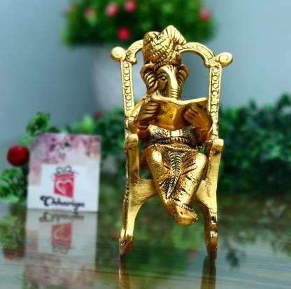 Golden Lord Ganesha Statue Sitting On A Rocking Chair And Reading Ramayan Showpiece - KalaKirtiHub